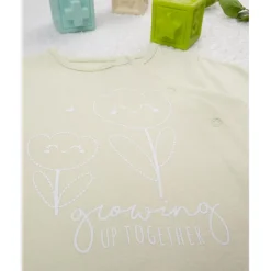 Mameluco verde con flores estilizadas*Prenatal Outlet